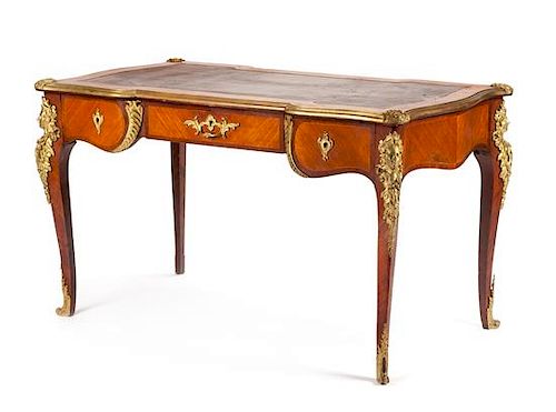 A Louis XV Style Gilt Bronze Mounted Kingwood and Mahogany Bureau Plat Height 30 x width 52 x depth 30 inches.