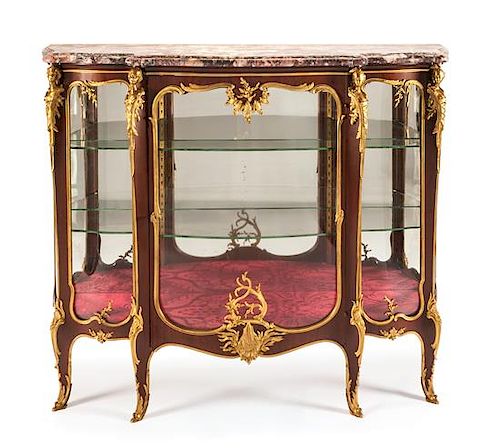 A Louis XV Style Gilt Bronze Mounted Mahogany Vitrine Cabinet Height 48 x width 55 x depth 19 inches.