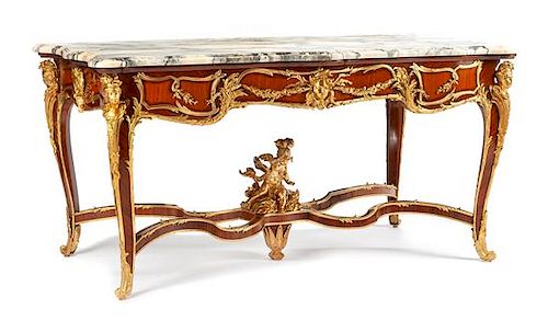 A Louis XV Style Gilt Bronze Mounted Salon Table Height 33 x width 64 1/2 x depth 36 inches.