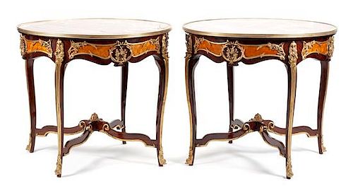 A Pair of Louis XV Style Gilt Bronze Mounted Parquetry Gueridons Height 31 x diameter of top 35 inches.
