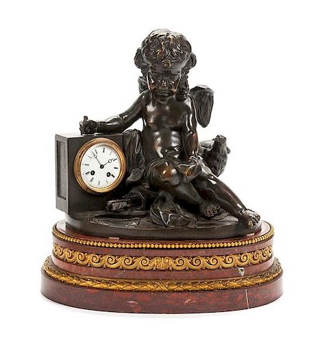 A Louis XVI Style Gilt and Patinated Bronze Mantel Clock Height overall 22 x width of base 20 inches.