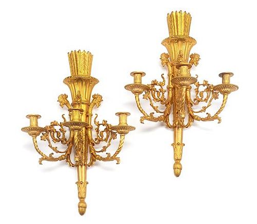 A Pair of Louis XVI Style Gilt Bronze Three-Light Sconces Height 23 1/4 inches.