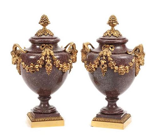 A Pair of French Gilt Bronze Mounted Porphyry Urns Height 23 inches.