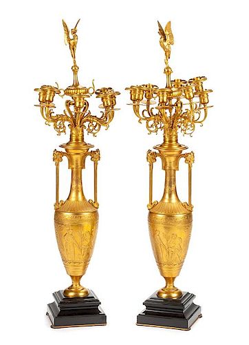 A Pair of French Neoclassical Gilt Bronze Eight-Light Candelabra Height overall 41 3/4 inches.