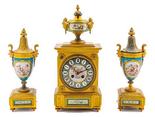 A Sevres Style Porcelain and Gilt Bronze Clock Garniture Height of mantel clock 18 inches.