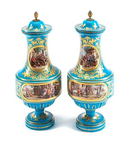 A Pair of Sevres Style Porcelain Vases and Covers Height 18 inches.