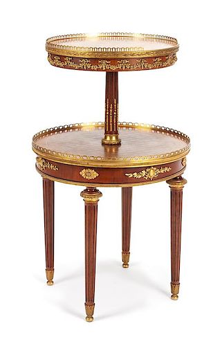A Napoleon III Gilt Metal Mounted Occasional Table Height 31 1/2 x diameter of larger tier 19 1/2 inches.