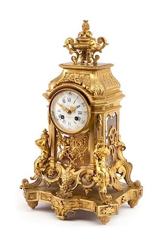 A Napoleon III Gilt Bronze Clock Height 18 1/8 x width 10 5/8 inches.