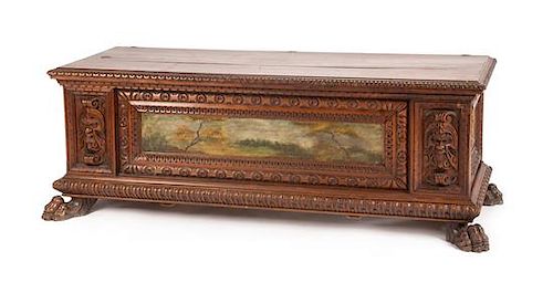 A Renaissance Revival Painted Walnut Cassone Height 24 x width 66 x depth 21 1/4 inches.