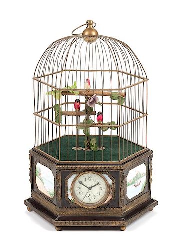 A Continental Automaton Porcelain Inset Birdcage with Clock Height 22 1/2 inches.