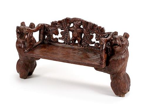 A Black Forest Carved Bench Height 24 x width 45 x depth 15 inches.