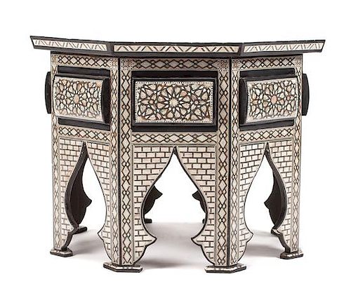 A Moorish Style Mother-of-Pearl Inlaid Table Height 22 1/2 x diameter of top 31 1/2 inches.