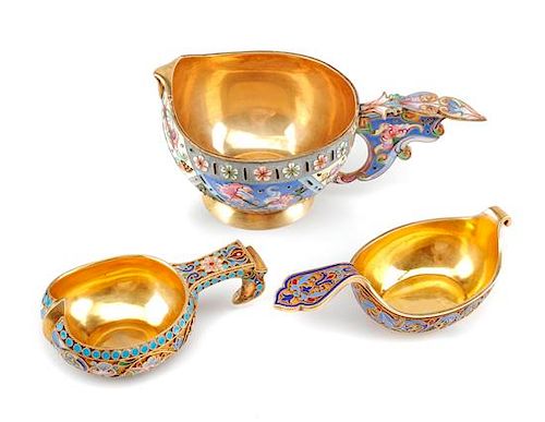 Three Russian Enameled Silver Kovshi, Various Makers, Late 19th/Early 20th Century, each having an exterior decorated with polyc