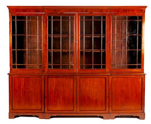 A George III Mahogany Breakfront Bookcase Height 85 x width 103 3/4 x depth 19 1/4 inches.