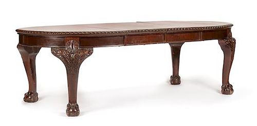 A George III Carved Mahogany Dining Table Height 29 x width 44 inches (closed).