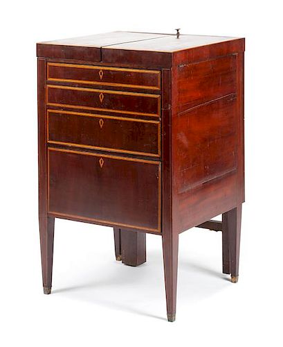 A George III Mahogany Lift-Top Dressing Table Height 35 x width 22 x depth 20 1/2 inches.