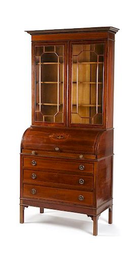 A George III Style Mahogany Cylinder Secretary Bookcase Height 90 x width 34 1/2 x depth 18 1/4 inches.