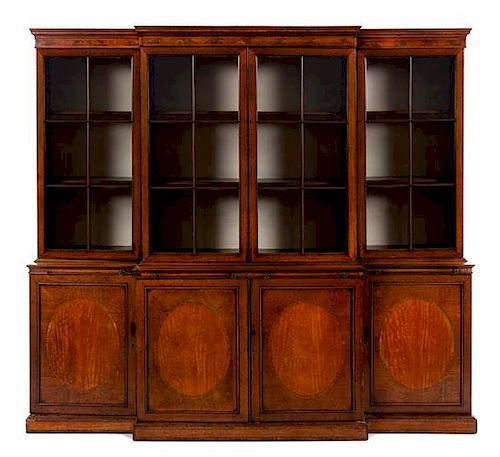 * An English Mahogany Breakfront Bookcase Height 94 x width 103 x depth 23 1/3 inches.