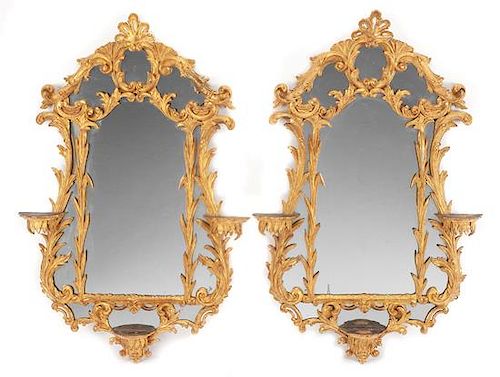 A Pair of Chippendale Style Carved Giltwood Mirrors Height 42 x width 27 inches.