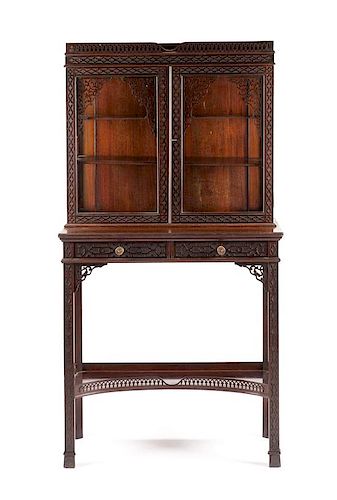 A Chinese Chippendale Style Mahogany Vitrine on Stand Height 56 3/4 x width 30 x depth 14 3/4 inches.