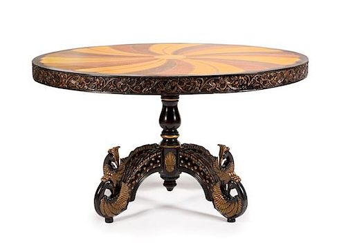 An Anglo-Colonial Style Various Woods Center Table Height 32 1/2 x diameter of top 54 1/4 inches.