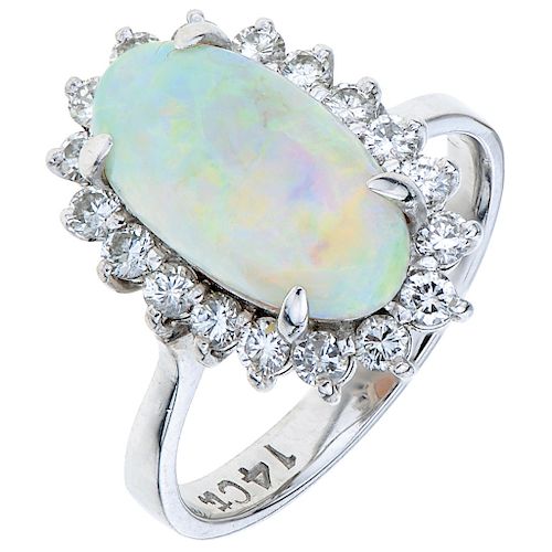 An opal and diamond 14K white gold ring.