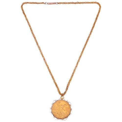 A 10K yellow gold necklace and pendant with a 21.6K yellow gold coin.