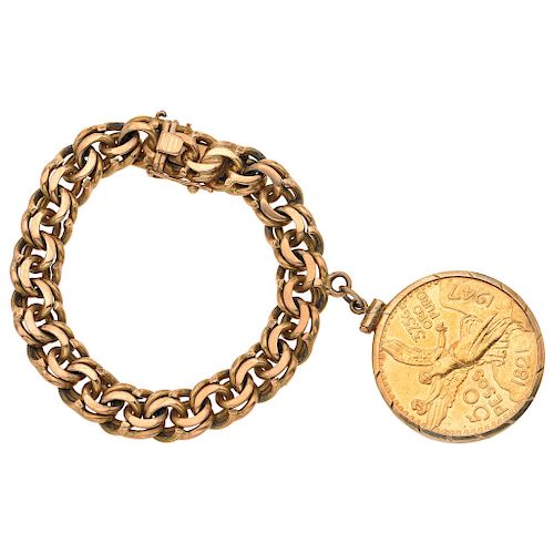 An 18K and 14K yellow gold bracelet with a 21.6K yellow gold coin.