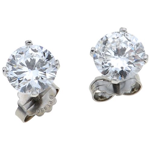 A diamond platinum pair of stud earrings.
