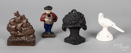 Four cast iron bookends and doorstops