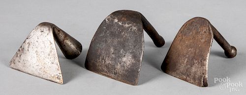 Three wrought iron dough scrapers