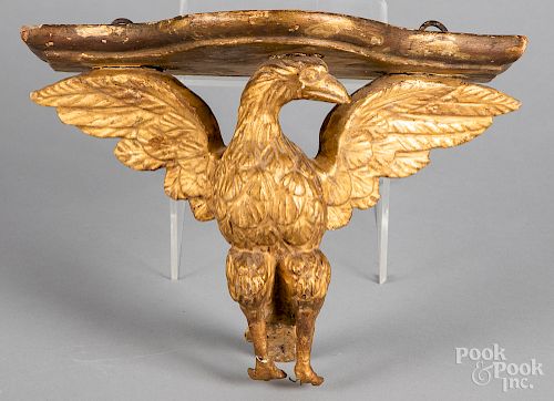 Carved and gilded eagle wall shelf
