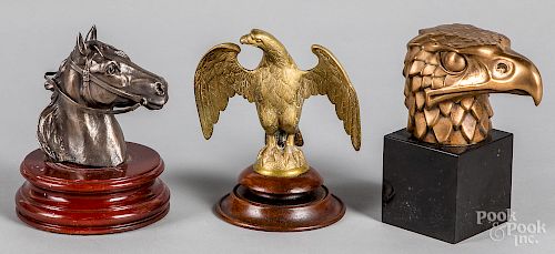 Two brass eagle finials, etc.