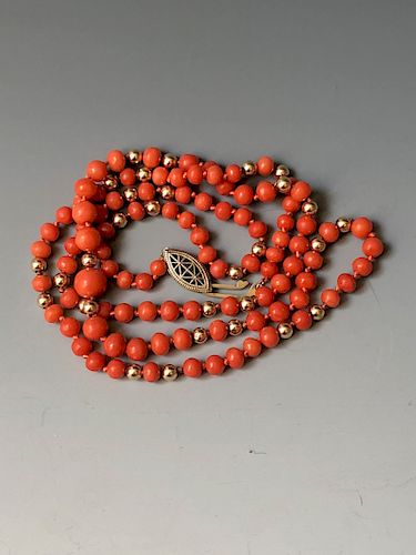 14K YELLOW GOLD CORAL NECKLACE. 