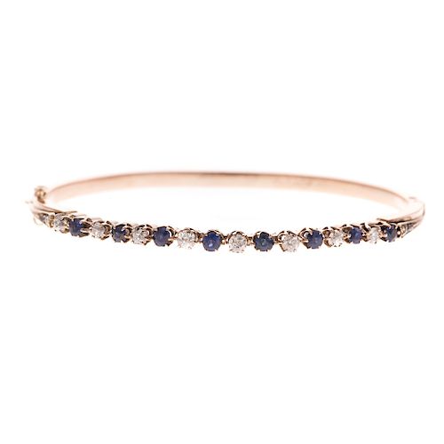 A Ladies Diamond & Sapphire Bracelet in 14K