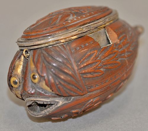 Antique French carved coquilla nut snuff box with carved top opening to small thin area and opposite side opening to larger gilt int...