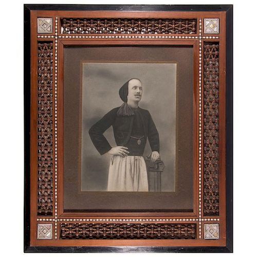 Framed photograph of a Middle Eastern man.