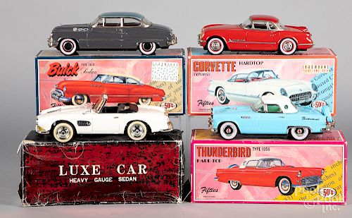 Four contemporary cars with boxes