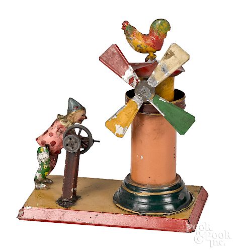 Unusual painted tin clown and windmill steam toy