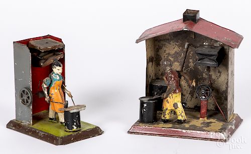 Two Arnold painted tin blacksmith steam toys