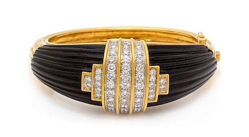 An 18 Karat Yellow Gold, Diamond and Onyx Bangle Bracelet, Montreaux, 69.45 dwts.