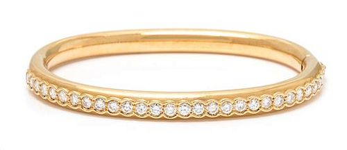 An 18 Karat Yellow Gold and Diamond Bangle Bracelet, Swiss, 23.25 dwts.