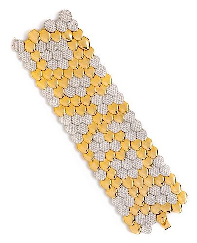 An 18 Karat Bicolor Gold and Diamond Scale Motif Bracelet, 125.90 dwts.