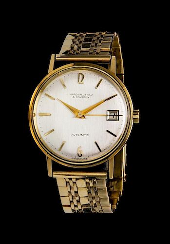 * A 14 Karat Gold Wristwatch, Marshall Field & Company,