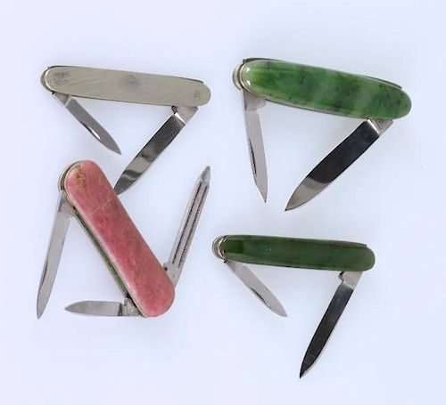 A collection of jade and hardstone pocket knives.