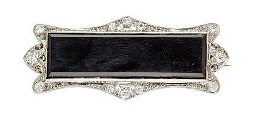 An Art Deco Platinum, Diamond and Onyx Brooch, Tiffany & Co., 5.0 dwts.