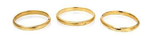A Collection of 14 Karat Yellow Gold Bangles, 18.90 dwts.