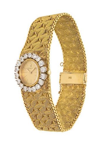 An 18 Karat Yellow Gold and Diamond Wristwatch, Corum, 35.50 dwts.