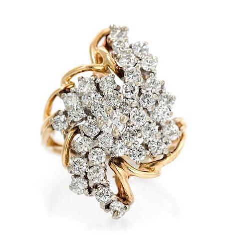 A 14 Karat Gold and Diamond Cluster Ring, 6.80 dwts.