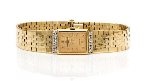 A 14 Karat Yellow Gold and Diamond Wristwatch, Baum & Mercier, 22.30 dwts.